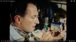 Peter Cushing painting his miniatures.