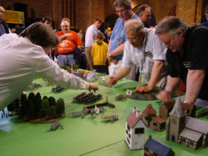 The War Gamers staged Sittangbad from "Charge!" at Partizan 2006 – Phil Olley (l), with Steve Gill (blue shirt), John Preece and your Editor (r). Note that this was when Partizan was still held in the dingy spaces of Kelham Hall.