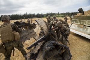 Marines deal with an obstacle.