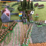 In an inspired move, the Grenouissian fusiliers are extricated from the firefight at the wall and replaced by their supports, flanked in their advance by the closest unit of fusiliers. In the distance, the dragoons deploy into column of squadrons and put a stop to the Borg outflanking, threatening to ride down the Jäger.